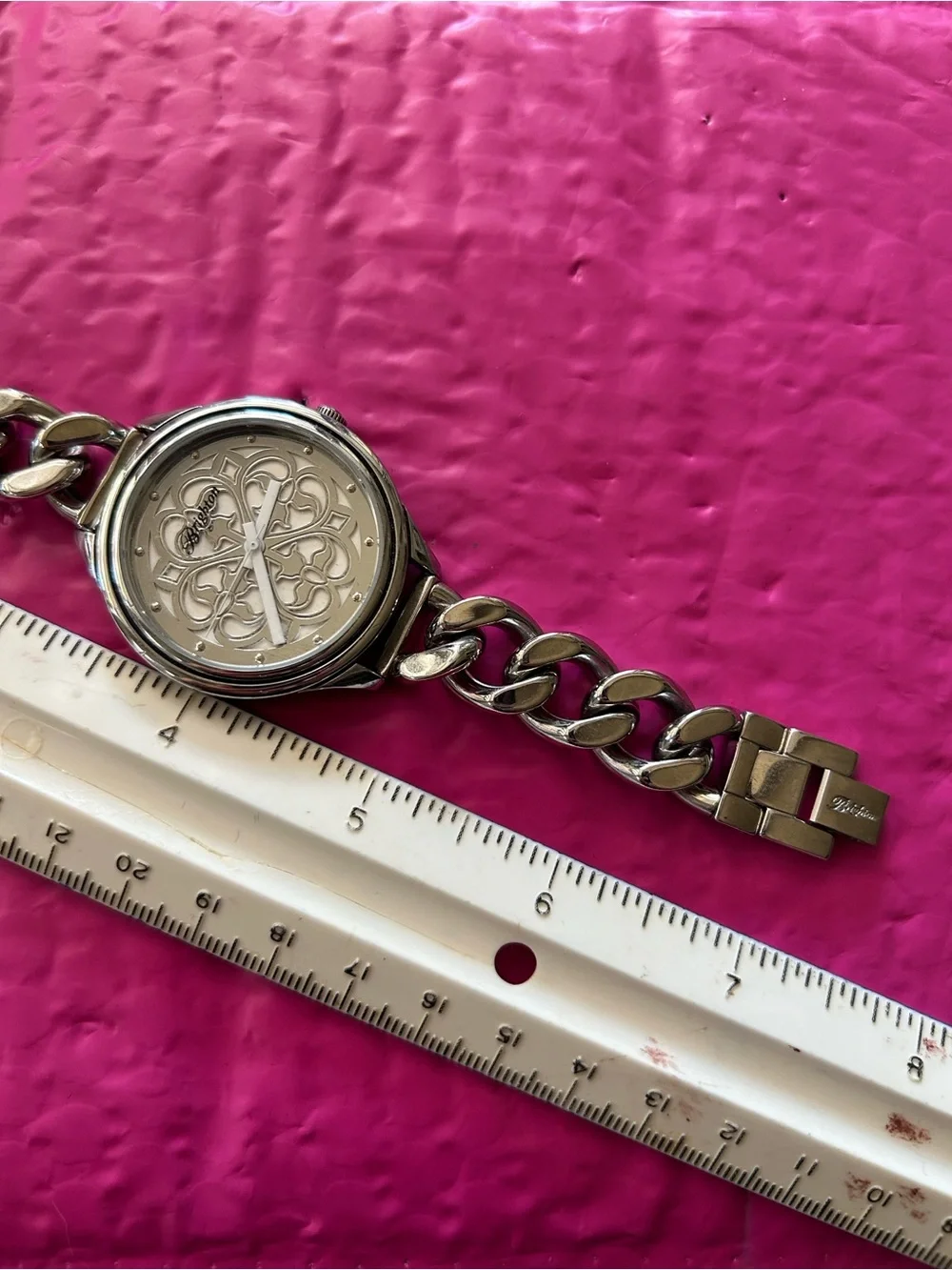 Brighton chain-link watch showcasing the ornate, scrollwork cut-out motif